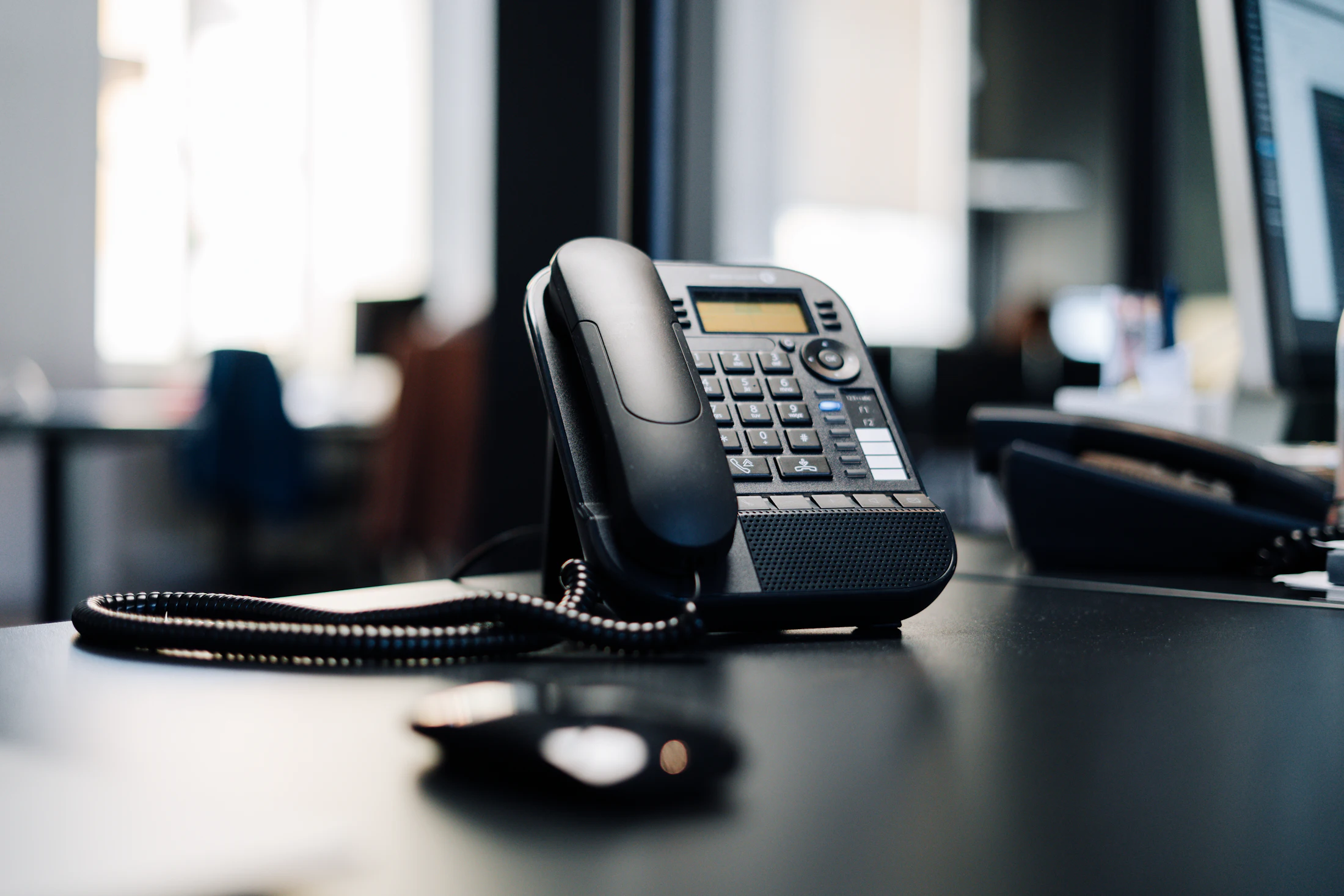 Business IP desk phone on an office desk